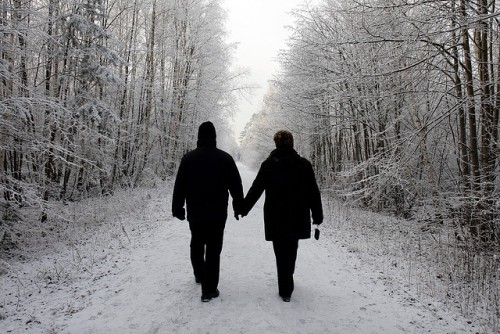 A couple walking in a winter wonderland.
